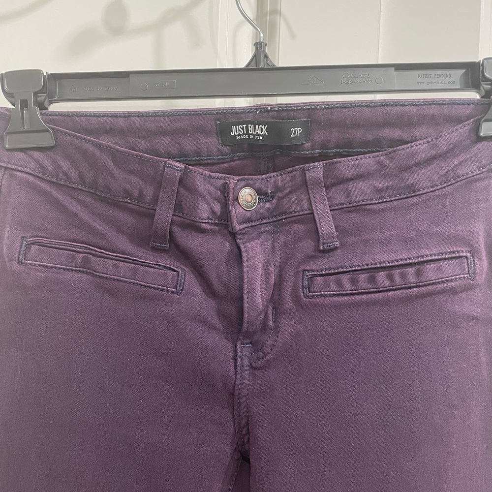 Dark purple low rise jeans.